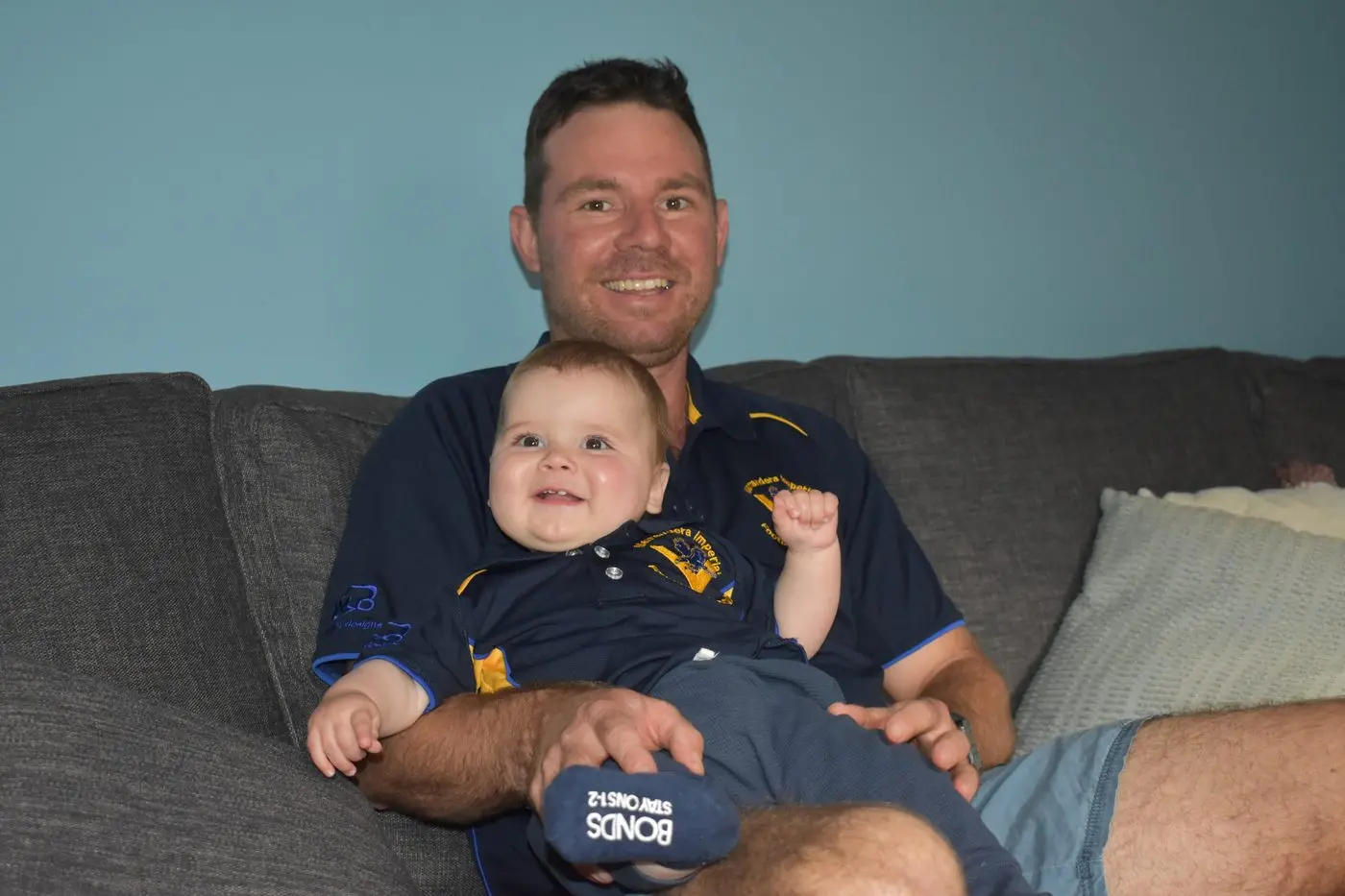 James Sullivan will no doubt be encouraging his son Spencer, eight months, to follow the family\\u2019s proud tradition in Aussie Football. Photo: Rustty-Lake Connolly.