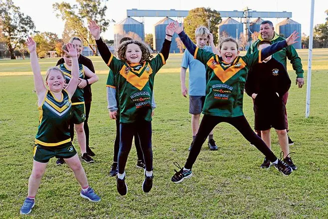 Lizards Junior Rugby League members jumping for joy over the prospect of a new grandstand are front, Imogen Hunt, Brooklyn Lyons and Sienna Lyons, and back, \\nKaren Hunt, Lachlan Hunt, Jaida-Lee Lyons, Samuel Hunt, Ruben Bamblett and Shaun Lyons. Photo: Kim Woods. 
