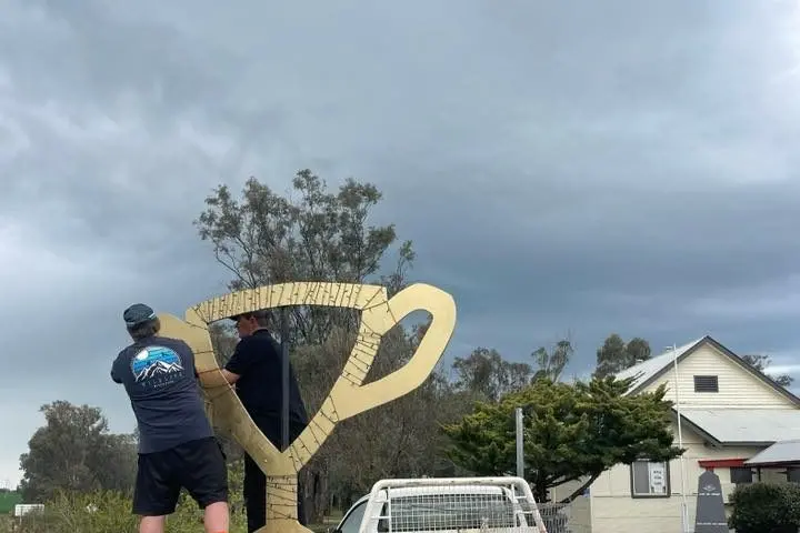 Burrumbuttock giant sized Melbourne Cup outside hall.