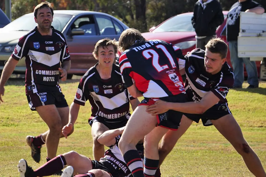 Barellan players Albert Gibson, Noah Forbutt and Beigh Hillier in the fray during the game against Ivanhoe. Photo: Jodi Evans