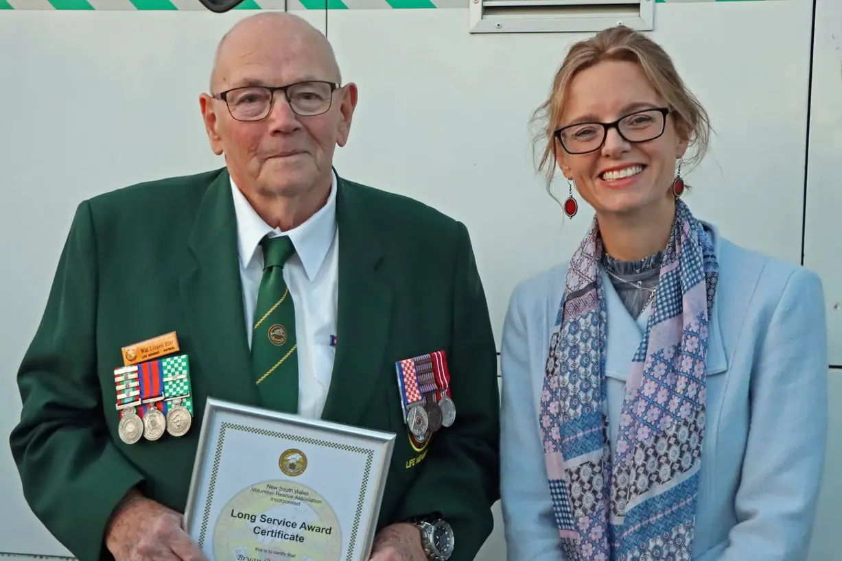 Bryan \\u201CWal\\u201D Lingen is congratulated on his award for 50 years of service by Member for Cootamundra Steph Cooke. Photo: Kim Woods