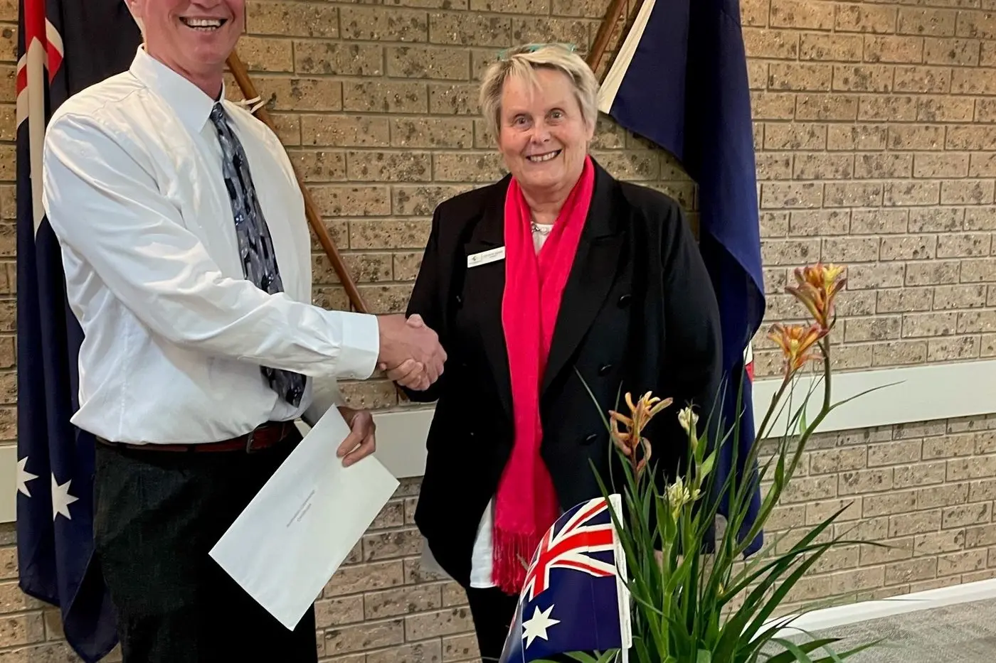 Murrumbidgee\\'s newest citizen Paul Wood being congratulated by Murrumbidgee Council Mayor Ruth McRae OAM.