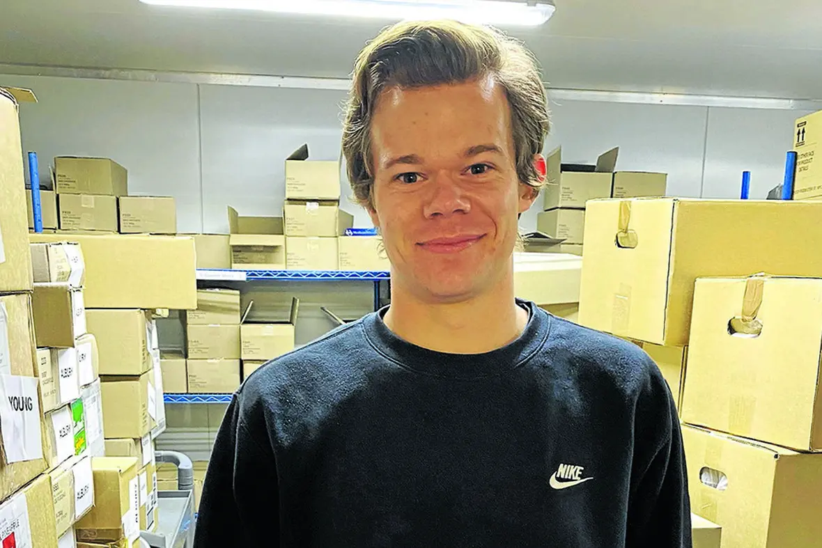 Narrandera Meals on Wheels storeperson Tom Davis busily working in the refrigerated distribution office to make sure clients and other services are receiving their orders. Photo: Claire Williams