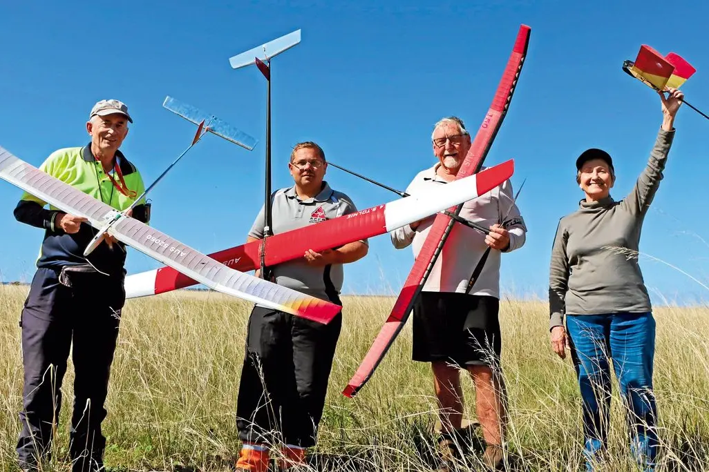 Malcolm Campbell, Brisbane, Shannon Tolmie, Tamworth, Tony Bond, Narellan, and Kathy Barford, Brisbane, with their models at the Australian Free Flight Society championships at Morundah. Photo: Kim Woods