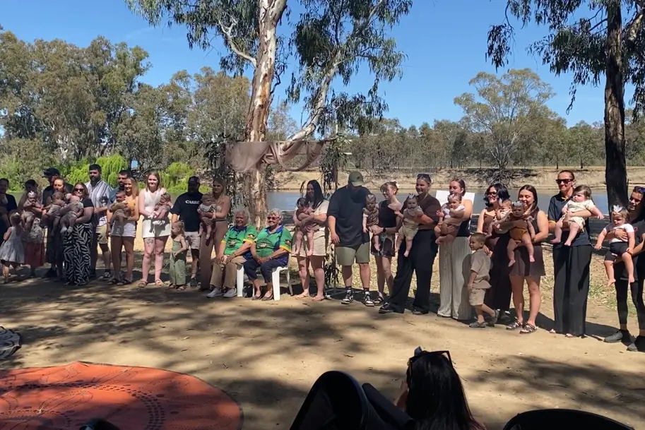 <p>Babies and families at the recent ceremony.</p>\\n