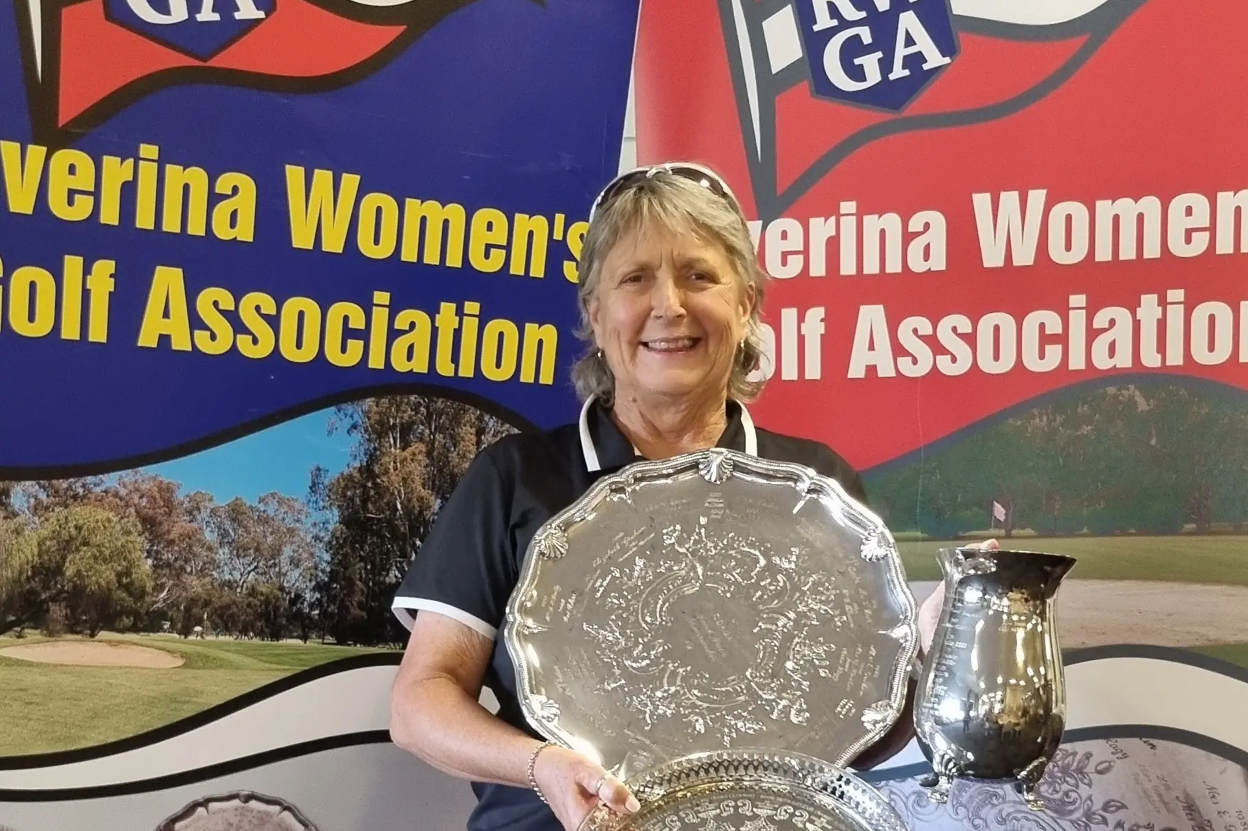 <p>Division One winner Glenda Whitby with her amazing haul of trophies.</p>\\n