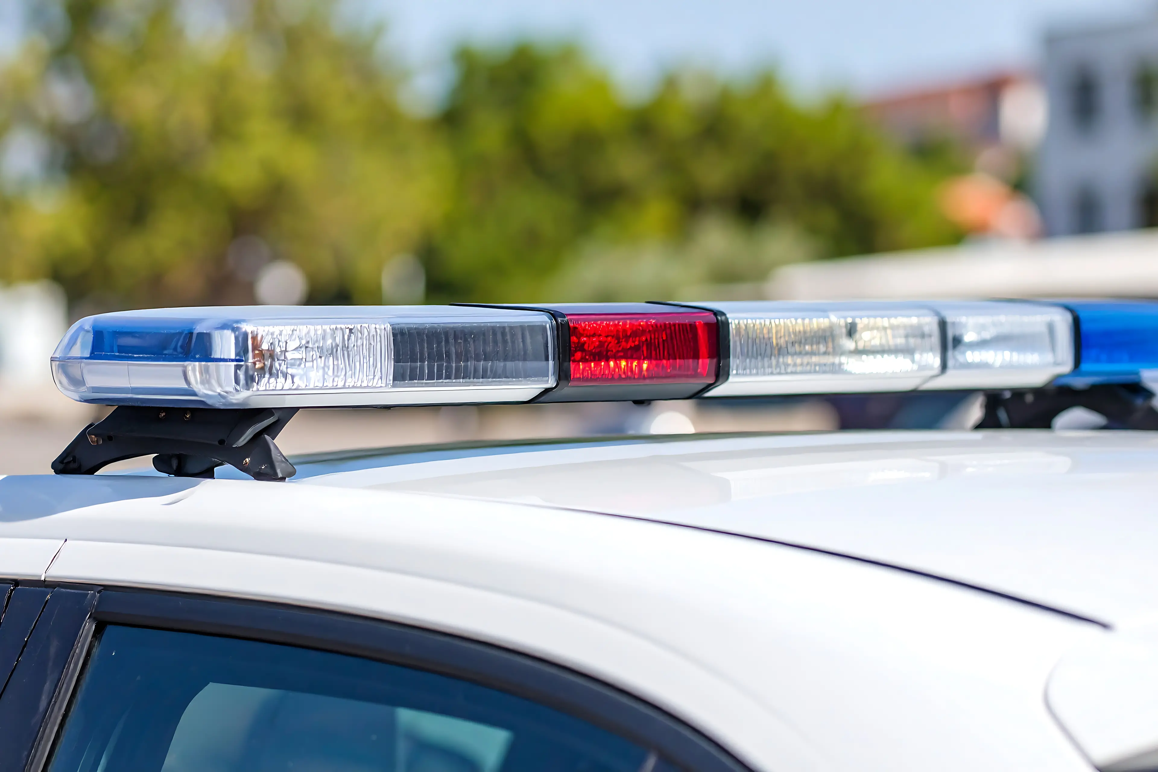 <p>Police car\\'s flashing lights</p>\\n