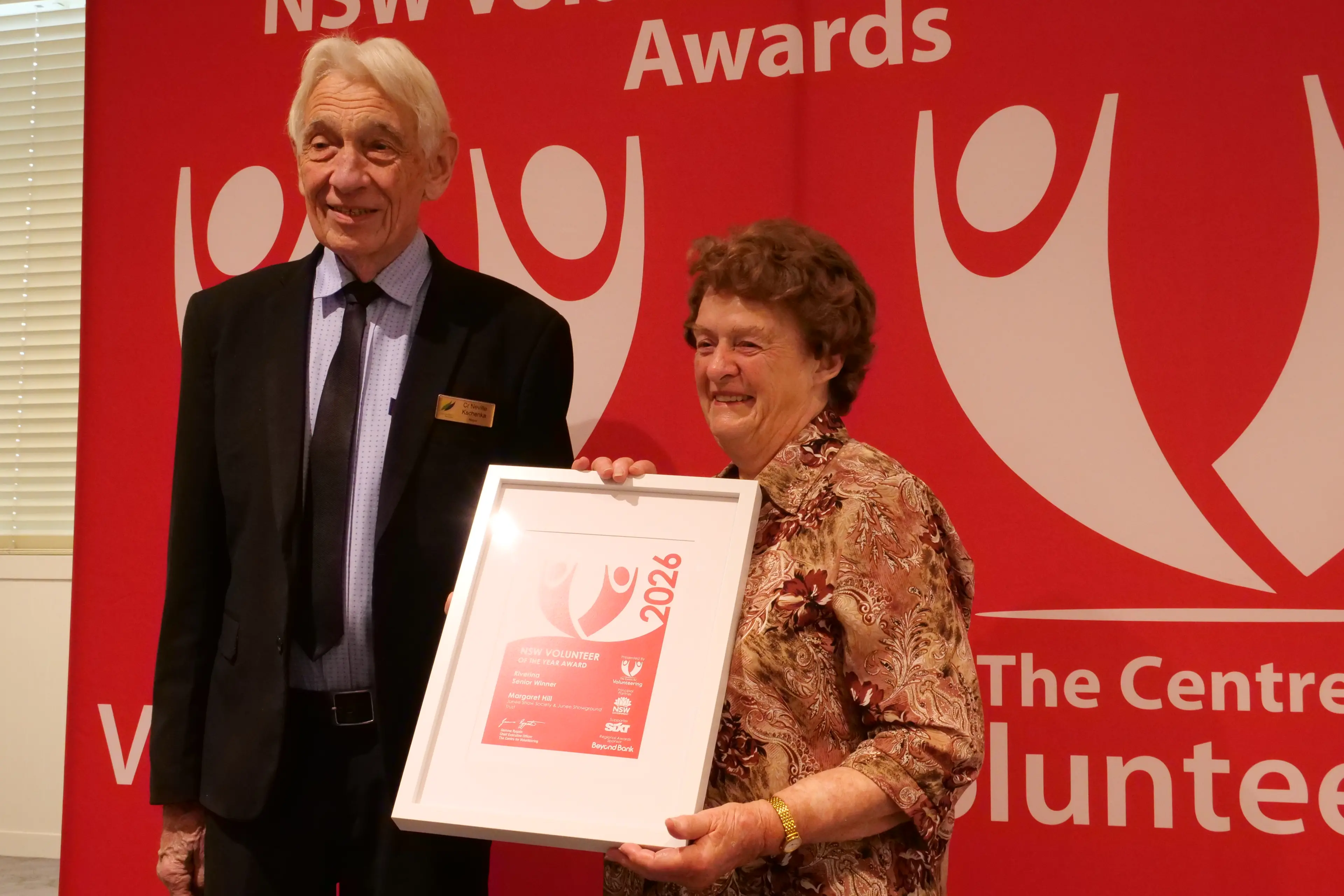 <p>NSC mayor Neville Kschenka presented the Riverina Senior Volunteer of the Year to Margaret Hill.</p>\\n